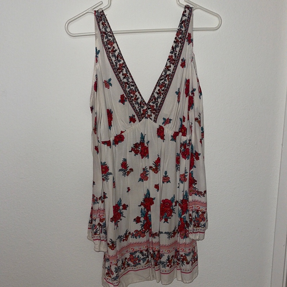 Floral printed peek a boo shoulder long sleeved dress.